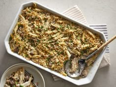 a casserole dish filled with pasta and mushrooms