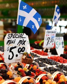 fresh fruits are for sale at a market stall with signs reading special mix $ 5 00