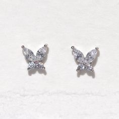 Be kissed by tiny butterflies all day in the Mari Studs! These are so delicate and perfect for everyday looks! White Butterfly Charm Earrings For Wedding, Everyday Dainty Earrings With Butterfly Charm, Dainty Nickel-free Butterfly Earrings, Dainty Butterfly Nickel-free Earrings, Dainty Butterfly Earrings For Everyday Wear, Dainty Butterfly Earrings For Anniversary, Elegant Butterfly Earrings For Everyday Wear, Elegant Butterfly Earrings For Everyday, Dainty Butterfly Earrings For Wedding