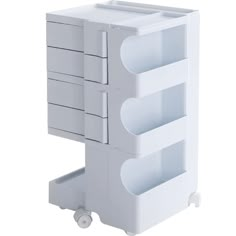 a white cart with three drawers on it