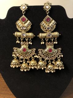 Temple Jewelry Style Wedding Jhumkas With Tilla, Temple Jewelry Tilla Jhumkas For Wedding, Wedding Temple Jewelry Tilla Jhumkas, Wedding Temple Jewelry Jhumkas With Tilla, Bollywood Style Wedding Jhumkas With Intricate Design, Bollywood Style Intricate Design Wedding Jhumkas, Bollywood Style Intricate Design Jhumkas For Wedding, Festive Stone Work Chandelier Earrings For Reception, Festive Chandelier Earrings With Stone Work For Reception