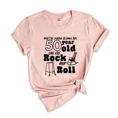 a women's pink shirt with the words 50 years old rock and roll on it