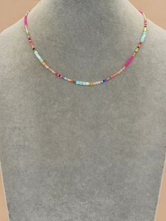 Sunshine, beach days and fun! This multi-colored beaded necklace has everything you need for effortless style while on vacation or hanging with friends in the sun! Total length: 16" with a 2" extender. Color and pattern may vary slightly. Please note: This is a final sale item and no returns or exchanges are accepted for this item. Product requires extended processing and shipping time. Simple Beaded Necklaces, Crystal Choker Necklace, Beaded Bracelet Patterns, Crystal Choker, Necklaces For Women, Beaded Necklaces, Colorful Boho, Stylish Jewelry, Bead Designs