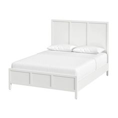 a white bed with two drawers on each side and a headboard made out of wood