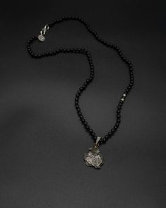 Add a touch of cosmic beauty to your collection with this Campo del Cielo meteorite pendant on a hand-knotted onyx and silver accented chain. The onyx chain is 59 cm long [app 23 in long] Meteorite Pendant, Mala Bracelet, Mala Necklace, Healing Stones, Ring Necklace, Womens Bracelets, Bracelets For Men, Ring Shopping, Handcrafted Jewelry