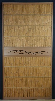 a bamboo door with decorative designs on it