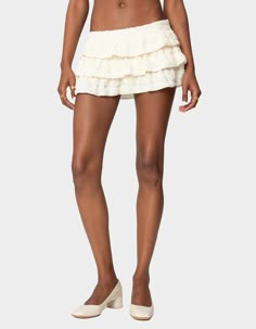 No Closet Is Complete Without The Perfect Mini Skort That Adds A Bit Of Flair To A Simple Top. This Ruffled Option Can Pair Perfectly With Anything You Have In Mind. Mini Skort. Tiered Ruffle Design. Side Zip Closure. Textured Fabric. 100% Polyester. Model Wears Size S. Model Height Is 5'9. Item Care: Machine Wash At Maximum 30ºc, Do Not Bleach, Do Not Tumble Dry, Iron At A Maximum Of 110ºc, Do Not Dry Clean. | Edikted Margaux Textured Ruffle Mini Skort Matching Mini Skirt And Top Set, Rush Skirt Outfit, Boho Chic Skirt, Silk Skirt Mini, Ruffle Mini Skirt Outfit, Gold Bengals, Cow Boy Hat, White Ruffle Mini Skirt, Mini Ruffle Skirt