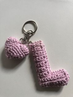 a crocheted keychain shaped like the letter j