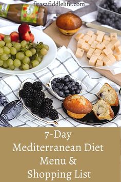 the 7 day mediterranean diet menu and shopping list is displayed on a table with grapes, bread