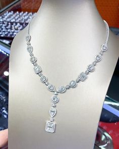 You'll never tire of wearing this unique and sophisticated eternity, Illusion diamond necklace. Stunningly set in 18K solid white gold, this breathtaking line of shimmering round & baguette diamonds necklace. So elegant, at 17.0-inch, this diamond necklace will take the viewers breath away. With over 10.21 cts. t.w. of sparkling, NATURAL, UNTREATED diamonds, all optimally cut to display maximum brilliant luster, this glamorous keepsake secures with a slide clasp lock as shown. The setting design Luxury Baguette Cut Necklace For Wedding, Exquisite Emerald Cut Diamond Necklace, Silver Emerald Cut Diamond Solitaire Necklace, White Gold Emerald-cut Baguette Diamond Jewelry, Emerald Cut Cubic Zirconia Diamond Necklace For Anniversary, Wedding Solitaire Necklace With Brilliant Radiant Cut, Emerald Cut Cubic Zirconia Diamond Necklace For Wedding, Emerald Cut Diamond Solitaire Necklace In Silver, Emerald Cut Silver Diamond Solitaire Necklace