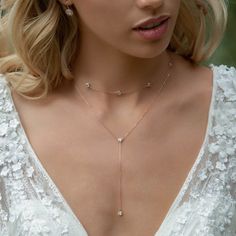 bridal jewelry, Swarovski necklace, bridal necklace, wedding necklace Handmade in NYC, please allow for 10-15 business days of crafting time. EXPEDITE ORDERS: Choose 5-day crafting time in pull-down menu and choose expedited shipping when checking out. ► Spend $200 | Receive 10% OFF Your Order with Code: 10OFF200 ► Please note in your order when your wedding date is MATERIALS + MEASUREMENTS: - .925 Sterling Silver or 14k Rose Gold/ 14K Gold over .925 Sterling Silver - Cubic Zirconia crystals 5 M White Round Drop Necklace For Wedding, Elegant Lariat Jewelry For Wedding, Dainty Lariat Backdrop Necklace For Party, Delicate Formal Backdrop Necklace With Adjustable Chain, Delicate Lariat Backdrop Necklace For Formal Occasions, Round Bridal Necklace For Wedding, Formal Delicate Backdrop Necklace With Adjustable Chain, Elegant Lariat Backdrop Necklace For Wedding, White Clavicle Chain Bridal Necklace For Wedding