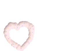 a donut shaped like a heart with sprinkles on it's side