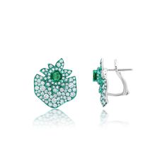 Sculptural botanical shapes indicative of Graziela's home country of Brazil. Gemstone: .85 Carats of Emeralds, 2.25 Carats of G-H Color White Diamonds Metal: 18K Gold Green Rhodium, 7.5 Grams Colors: White Gold, Green Rhodium Measurements: 3/4" X 3/4" Finishing: Omega & Post Back Luxury Green Sterling Silver Earrings, Luxury Green Gemstone Earrings, Luxurious Green Sterling Silver Earrings, Luxury Green Clip-on Jewelry, Fine Jewelry Green Diamond Earrings, Luxury Green Emerald Earrings, Luxury Green Earrings For May Birthstone, Green Clip-on Earrings Fine Jewelry, Earrings 2024