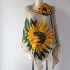 a white mannequin with a yellow sunflower on it