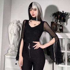 When Darkness Comes Top. This sheer mesh top has flared bell sleeves and a collar neckline with a back closure and a front cutout. Product Details Black Polyester, Spandex Size Guide Size Chest Waist Sleeve Length S 77 64 70 M 81 69 71 L 85 73 72 Unit: cm NOTE: 1. Please strictly follow the size chart to select the size. Do not select directly according to your habits. 2. The size may have 2-3cm differs due to manual measurement. Please note when you measure How to Measure To choose the correct Gothic Black Stretch Mesh Top, Black Stretch Gothic Mesh Top, Black Gothic Tops With Mesh Sleeves, Gothic Party Top With Mesh Sleeves, Spring Gothic Mesh Top, Gothic Party Tops With Mesh Sleeves, Stretch Tops For Cosplay, Gothic Black Mesh Top For Fall, Gothic Sheer Top For Party