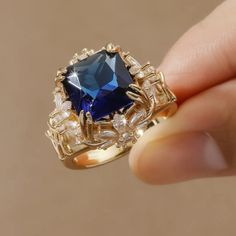 Beautiful Simulated Sapphire Gold Plated Ring.. Wow! Sizes Available: 7, 8 Blue Sapphire Ring For Party, Blue Ring Jewelry For Party, Blue Party Ring Jewelry, Elegant Blue Sapphire Open Ring, Blue Crystal Ring For Party, Elegant Blue Crystal Ring Gift, Blue Crystal Party Ring, Elegant Blue Open Ring, Elegant Blue Crystal Gemstone Ring