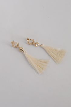 The Gracelyn Gold Tassel Earrings are the hit of the party! These trendy earrings start with a stud post back and have a tassel detail. Add these fun earrings to a black dress + heels to add a chic touch to your date night look! Gold Plated Tassels Stud Post Back One Size | Length 3” Black Dress Heels, Black Dress With Heels, Gold Tassel Earrings, Beaded Tassel Earrings, Dress Heels, Earrings Trendy, Trendy Earrings, Beaded Tassels, Night Looks