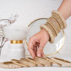 Beautify your traditional look with an elegant set embodying culture and style! This luxurious bridal bangle set is designed with exquisite gajra bangles and champagne stones that will make you sparkle with beauty on your big day. Available in various sizes. Gold-plated on high-quality brass as base metal.Size 2.6 (Single set) is in-stock and ready to ship. *Please Note: We use faux stones and beads in all of our jewelry.