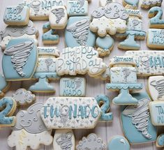 many decorated cookies are arranged on a table