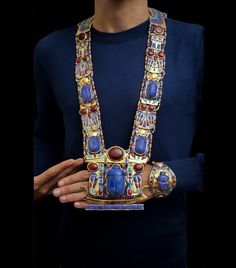 The One-of-a-kind Necklace for King Tutankhamun is now for sale in our store. The Royal Scarab Necklace for King Tutankhamun which was found in his coffin with the rest of his collection.  The Royal Pectoral is made from Natural Lapis Lazuli stone with finest Brass plated with 24k Gold The full collection is available upon request. Gringotts Vault, Ancient Egyptian Fashion, Scarab Necklace, King Tutankhamun, Egyptian Fashion, Eclectic Jewelry, Black God, Islamic Jewelry, Wedding Bracelets