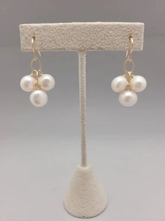 Three freshwater pearls dangle from gold filled chain. Simple, sophisticated and easily dressed up or down all year long. Lightweight and perfect for bridesmaids or graduation gifts.  All pieces will be packaged together in a cotton filled jewelry box unless otherwise specified. Please let us know if your order is a gi Elegant 14k Gold Filled Jewelry For Wedding, 14k Gold Filled Pearl Drop Jewelry For Gift, Handmade 14k Gold Filled Jewelry For Formal Occasions, Elegant 14k Gold Filled Wedding Jewelry, Classic White 14k Gold Filled Jewelry, Gold Delicate Pearl Earrings For Bridesmaid, Elegant Pearl White 14k Gold-filled Pearl Earrings, Elegant 14k Gold-filled Pearl White Pearl Earrings, Elegant White Pearl Earrings In 14k Gold