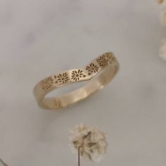 Elegant and unique 14k gold V shaped wedding ring, Vintage style floral wedding band, unique gold wedding ring for the stylish bride to be! This band can be worn by itself or stacked with other rings as shown in the second photo. * Band width: 2.8 mm* Thickness: 1 mm* Available in 14K or 18K YELLOW, WHITE and ROSE gold.   The price listed is for 14K please contact me for 18K pricing.* Sizes vary from 5 US to 8 US, including half sizes.    Please choose your size upon checkout.* Please choose a f Dainty 14k Flower Wedding Ring, Wedding Flower Ring Stamped 14k Gold, Wedding 14k Gold Flower Ring, 14k Stamped Flower Ring For Wedding, Yellow Gold Flower Ring Stamped 14k For Wedding, Gold Engraved Flower Ring For Wedding, Stackable Flower Ring With Round Band For Wedding, Stackable Flower Ring For Wedding, 14k Gold Flower Ring For Wedding