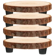 three pieces of wood stacked on top of each other in the shape of four logs