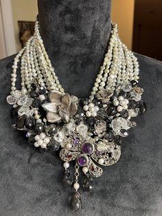 "This beauty is a one of a kind for sure !  All findings  and anything silver has been tested and is 925  sterling , all gem stones also tested and are genuine with baroque pearls adorning the bib it's suspended from   This is a collectors dream showing detail to every inch. The gemstones are amethyst and tourmaline in the butterfly and most all of the clear gems around the entire bib are registering as amethyst although clear.  The crystals are amazing !! This is truly a fabulous piece of artwork hallmark tag says \"jessie\"  In my research i did not find another like it any place.     Shipping with insurance will be provided." Silver Multi-strand Jewelry With Pearl Pendant, Unique Pearl Necklace For Wedding, Unique Gemstone Necklace With Mother Of Pearl, Elegant Multi-strand Beaded Necklace With Silver Beads, Elegant Multi-strand Silver Beaded Necklaces, Silver Crystal Bib Necklaces Costume Jewelry, Silver Crystal Bib Necklace Costume Jewelry, Elegant Multi-strand Gemstone Necklaces, Pearl Pendant Costume Jewelry