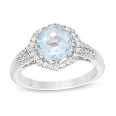 Provide a regal essence with this splendid gemstone ring. Fashioned in sterling silver, this intriguing look features an 8.0mm sky-blue topaz centered in an octagon-shaped halo of shimmering lab-created white sapphires. Additional created sapphires line the shank. Polished to a bright shine, this design pairs well with her evening attire. This ring is custom-made to fit your ring size. Sterling silver rings cannot be resized after purchase. Light Blue Fine Jewelry With Center Stone, Light Blue Diamond Ring In Fine Jewelry Style, Light Blue Center Stone Fine Jewelry, Fine Jewelry Blue Topaz Ring With Round Stone, Elegant Blue Topaz Ring With Center Stone, Dazzling Blue Topaz Ring With Center Stone, Formal White Gold Aquamarine Birthstone Ring, Dazzling Blue Topaz Jewelry With Center Stone, White Gold Topaz Ring With Gemstone Accents