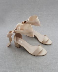 a pair of women's shoes with bows on the toes and heels are shown