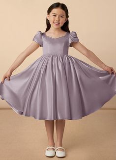 Juno is our sweet and classy matte satin dress. She features adorable puff sleeves, a sweetheart neckline, a A-line skirt, and a beautiful bow at the back of the dress. Satin Flower Girl Dresses, Frock Models, Short A Line Dress, Party Dress Classy, Satin Flower Girl Dress, Xmas Dress, Aesthetic Galaxy, Cute Dresses For Party, Kids Party Dresses