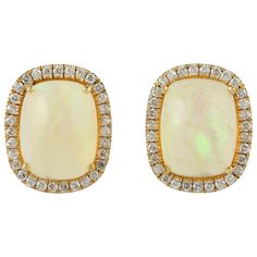 Handcrafted from 18-karat gold, these stud earrings are set with 3.2 carats Ethiopian opal and .24 carats of sparkling diamonds. FOLLOW MEGHNA JEWELS storefront to view the latest collection & exclusive pieces. Meghna Jewels is proudly rated as a Top Seller on 1stDibs with 5 star customer reviews. All items manufactured by us are handmade and can be customized or redesigned. Composition Size-12X10 MM Total Weight-3.55 Gold Weight(Gms)-2.862 Diamond Wt(Cts)-0.24 Ethiopian Wt(Cts)-3.2 Earrings For Sale, Gold Stud Earrings, Gold Stud, 2 Carat, Sparkle Diamonds, Top Seller, Gold Earrings Studs, Gold Studs, Ethiopian Opal