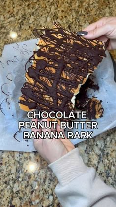 chocolate peanut butter banana bark is being cut into pieces with the words chocolate peanut butter banana bark