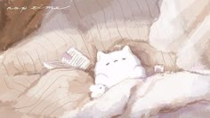 a white cat laying on top of a bed under a blanket next to a pillow