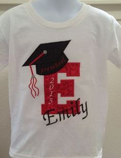 a white shirt with a red and black graduation cap on it