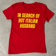 in search of hot italian husband shirt ironic funny unhinged slogan Fun Fitted Red Tops, Fitted Red Slogan Top, Funny Red Tops With Letter Print, Funny Red Tops With Screen Print, Funny Red Top With Screen Print, Red Funny Tops With Letter Print, Funny Red Screen Printed Top, Fun Fitted T-shirt With Text Print, Fitted Fun Red Top