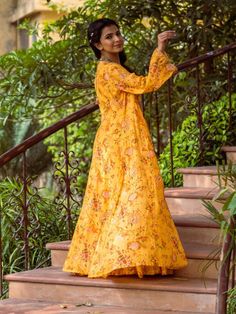 This Set has a crop top, skirt and jacket. In shades of yellow the floral printed long jacket set with gotta Patti hand work detailing on the bell sleeves and high waist flared skirt with matching crop top is perfect for haldi or mehendi ceremony. Color: Yellow Fabric: Cotton Silk Product Details: Neck Type - Rectangle Choli Length - 15 inches Jacket Length - 55 inches Bottom Length - 38-40 inches Sleeve Length - 22 inches Note: Available in other colors The product will be delivered within 2-4 Jacket Lehenga, Mehendi Ceremony, Skirt And Jacket, Gotta Patti, Crop Top Skirt, Silk Jacket, Yellow Fabric, Long Jacket, Shades Of Yellow