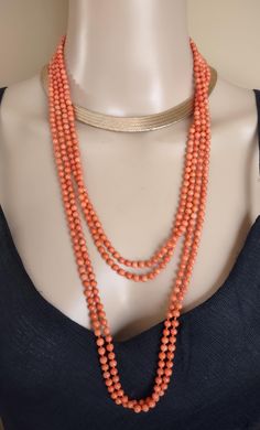 Beautiful  Coral 5mm beads necklace.  Salmon pink color, not red. 100 inches long, no clasp. Good Antique  Pre  Owned  Condition   Pics ENLARGED  to  see  details   All sales are Final no return. Elegant Hand-strung Round Beads Long Necklace, Elegant Hand-strung Necklace With Round Beads, Elegant Long Necklace With Hand-strung Round Beads, Elegant Multi-strand Gemstone Beads, Elegant Coral Beaded Necklaces With Faceted Beads, Elegant Coral Beaded Necklace With Faceted Beads, Formal Double Strand Beaded Necklace With Faceted Beads, Elegant Hand-strung Beaded Necklaces, Elegant Long Necklace Beads