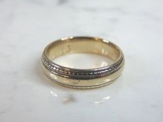 "FOR SALE IS THIS ATTRACTIVE MENS VINTAGE ESTATE 14K WHITE GOLD BAND WEDDING RING. THE TOTAL WEIGHT IS 8.8g AND IS A SIZE 10.75. THE WIDTH OF THE RING MEASURES 1/4\". RING IS MARKED 14K ON THE INSIDE OF THE BAND. ANY QUESTIONS, PLEASE DON'T HESITATE TO ASK. THIS WOULD MAKE A GREAT GIFT FOR THAT SOMEONE SPECIAL. BE SURE TO CHECK OUT SOME OF OUR OTHER GREAT ITEMS UP FOR SALE. THANK YOU. IF THERE ARE ANY ISSUES PLEASE CONTACT US, WE'RE ALWAYS HAPPY TO TRY TO HELP YOU OUT AS BEST AS WE CAN." Yellow Gold Engraved Ring Stamped 14k For Marriage, Classic Yellow Gold Engraved Couple Rings, Classic Wedding Band With Diamond Cut, Classic Diamond Cut Wedding Band, Heirloom 14k Engraved Wedding Ring, Classic Wedding Band For Anniversary, Classic Marriage Rings With Band Shape, Classic 14k Stamped Couple Rings, Timeless 14k Stamped Bands For Formal Occasions