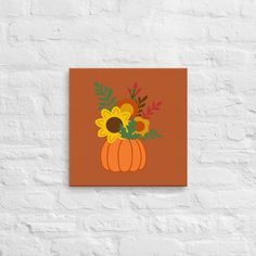 a painting on a brick wall with flowers and leaves in a pumpkin shaped vase next to it