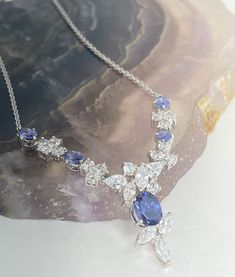 About Stunning blue and clear CZ rhodium plated. No missing stones. Marked THAILAND and RP.  Condition: Vintage (see photos for exact details as they are the best representations of the item).  Item will be thoughtfully packaged in a jewelry gift box.  Item pictured is the EXACT item being sold! Shop Sassy So Sweet Boutique:  https://sassysosweetboutique.etsy.com #sassysosweetboutique#love#JESUS#explore Dazzling Blue Necklace With Brilliant Cut, Blue Pear-shaped Sapphire Necklace, Formal Blue Necklaces With Stones, Formal Blue Necklace With Stones, Formal Blue Stone Necklace, Blue Stone Necklace For Formal Occasions, Blue Multi-stone Necklaces For Anniversary, Dazzling Blue Bridal Necklace For Wedding, Elegant Blue Multi-stone Necklace