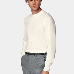 A classic crewneck knit for simple layering on any occasion, this soft off-white cashmere sweater is a luxurious and essential addition to any winter closet. Elegant Winter White Sweater With Ribbed Cuffs, Formal Cashmere Crew Neck Sweater, Modern White Sweater With Ribbed Cuffs, White Wool Crew Neck Sweater, Modern White Sweater For Fall, Classic White Sweater With Ribbed Cuffs, Winter White Crew Neck Cashmere Sweater, Winter White Cashmere Crew Neck Sweater, White Cashmere Tops With Ribbed Cuffs