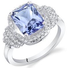 A multidimensional experience Add a sedated elegance to any ensemble with this unrestrained Tanzanite beauty. This standout ring features a cushion cut Peora simulated Tanzanite gemstone in .925 sterling silver. Technically crafted and cut for optimum brilliance, our simulated Tanzanite gemstones are optically identical to their mined counterparts, but they are made using alternative materials. We're big fans of eco-luxury. Handcrafted in pure .925 sterling silver goodness, this ring has been carefully coated in an elegant rhodium finish. Our artisans are expertly trained in this process which fortifies the ring's strength, shine and brilliance. Too many pieces on your wishlist and can't decide? Good problems to have! Our concierge stylists are here to help with all of your jewelry questio Jewelry Questions, Blue Gemstone Rings, Blue Topaz Bracelet, Silver Cocktail, Tanzanite Ring, Tanzanite Gemstone, Fashion Jewelry Sets, Sterling Silver Earrings Studs, Cocktail Ring