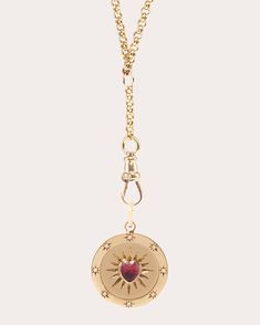 Suspended from Ashley Zhang's signature Arin chain, this 14-karat gold necklace details its circular pendant with a heart-cut ruby center. Radial motifs and diamond-embellished stars create a celestial effect. Spring ring clasp 14k yellow gold, pink tourmaline and recycled diamond Diamond carat: 0.05 ctw Polish with soft cloth Handmade in the USA Measurements Chain length: 18in with 1.5in extender Pendant width: 0.61in Pendant length (including bail): 1.08in Pink Gold Pendant Necklace With Gemstone, Fine Jewelry Yellow Pendant, Luxury Gold-tone Pendant Charm Necklaces, Luxury Yellow Oval Pendant Jewelry, Yellow Gold Tourmaline Pendant Necklace, Diamond Pendant Necklace, Pink Tourmaline, Spring Rings, Diamond Pendant