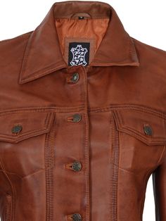 Introducing our women's cognac brown Leather Trucker Jacket - a must-have for the fashion-conscious woman. Crafted from high-quality leather, it offers durability and a chic, casual design. Stay comfortable with its warm polyester lining. The timeless shirt collar and eye-catching cognac color make it versatile and easy to pair with any outfit. Elevate your style today. Specification: 100% real lambskin leather Internal soft polyester lining Front zip closure, and shirt collar Ribbed hem and cuf Womens Brown Leather Jacket, Womens Brown Jacket, Asymmetrical Leather Jacket, Leather Trucker Jacket, Maroon Leather Jacket, Leather Jacket For Women, Black Leather Blazer, Tan Leather Jackets, Black Leather Moto Jacket