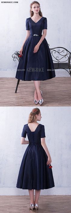 Navy Short Sleeve Midi Dress For Party, Elegant Navy Short Sleeve Midi Dress, Elegant Blue Short Sleeve Knee-length Dress, Elegant Blue Tea-length Midi Dress, Navy Knee-length Midi Dress For Formal Occasions, Navy A-line Midi Dress For Party, Navy Vintage Short Sleeve Dress, Navy V-neck Midi Dress For Evening, Short Prom