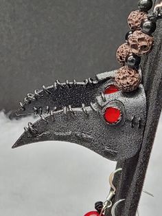 a close up view of a skateboard with beads on it's back end