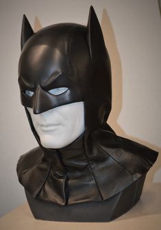 a batman mask is shown on top of a table