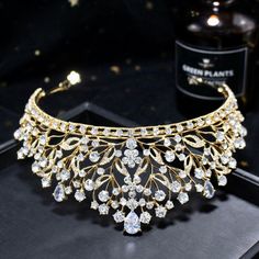 Up your sparkle factor with this romantic tiara design that can complete the most sophisticated of bridal looks. Intricately faceted cubic zirconia work their way across the band and capture the light from every angle with a perfectly translucent appeal. Cast in lightweight alloy and silver/yellow gold/rose gold plated for a flawless finish, the headband measures 2.5" at the tallest point (approx. 6.3cm) and 6" in diameter (approx. 15cm). Two small loops at each end make it easy to attach to you Tiara Design, Kings Crown, Crystal Tiaras, Wedding Tiara, Bridal Crown, Bridal Tiara, Clear Rhinestones, Wedding Hair Accessories, Bridal Looks