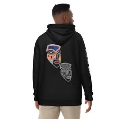 This mask design is a symbol of identity for everyone, no matter your age, background or race. It is inspired by the indigenous Igbo tribe in Nigeria, and acts as a point of contact to all those who are from an indigenous background or culture.  Wearing this hoodie is a great way to connect with your roots and celebrate the cultural diversity of Africa.                                                                                                                              "IGBO AMAKA!" PRODU Urban Hoodie With Front And Back Print For Winter, Winter Hoodie Sweatshirt With Front And Back Print, Winter Hoodie With Front And Back Print, Winter Streetwear Sweatshirt With Front And Back Print, Winter Hoodie With Graphic Design, Pop Culture Graphic Print Hoodie For Winter, Igbo Symbols, Uli Igbo Tattoo, Winter Graphic Hoodie